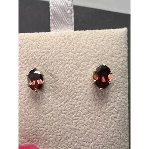 Oval cut red zircon sterling silver stud earrings